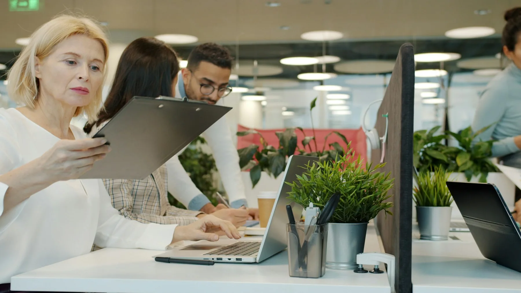 Colleagues working through a shared task at a table